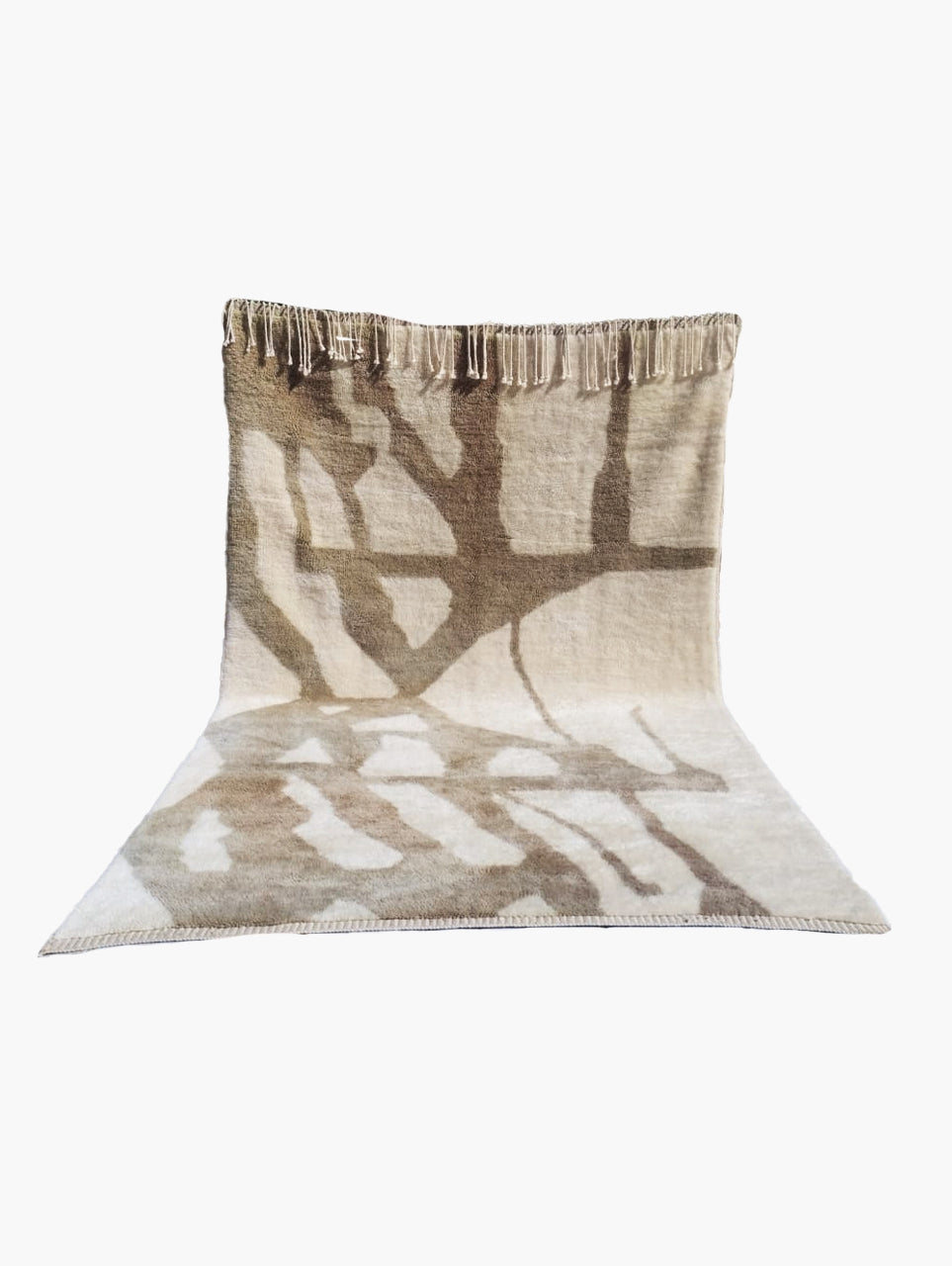 A beige and brown wool area rug with an abstract pattern.