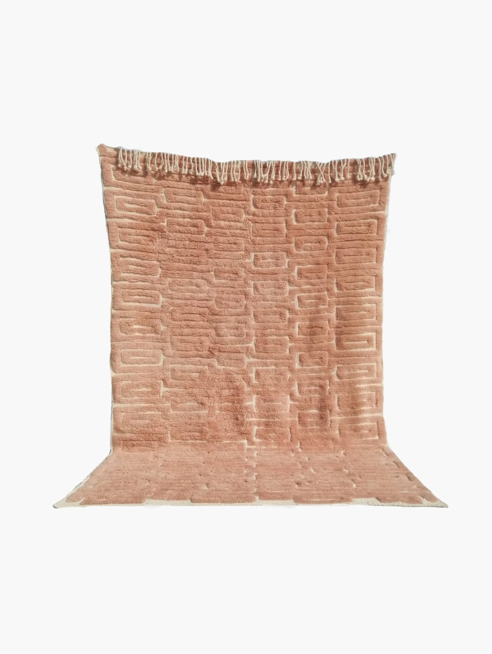 A gold wool rug with a textured pattern displayed against a plain background.