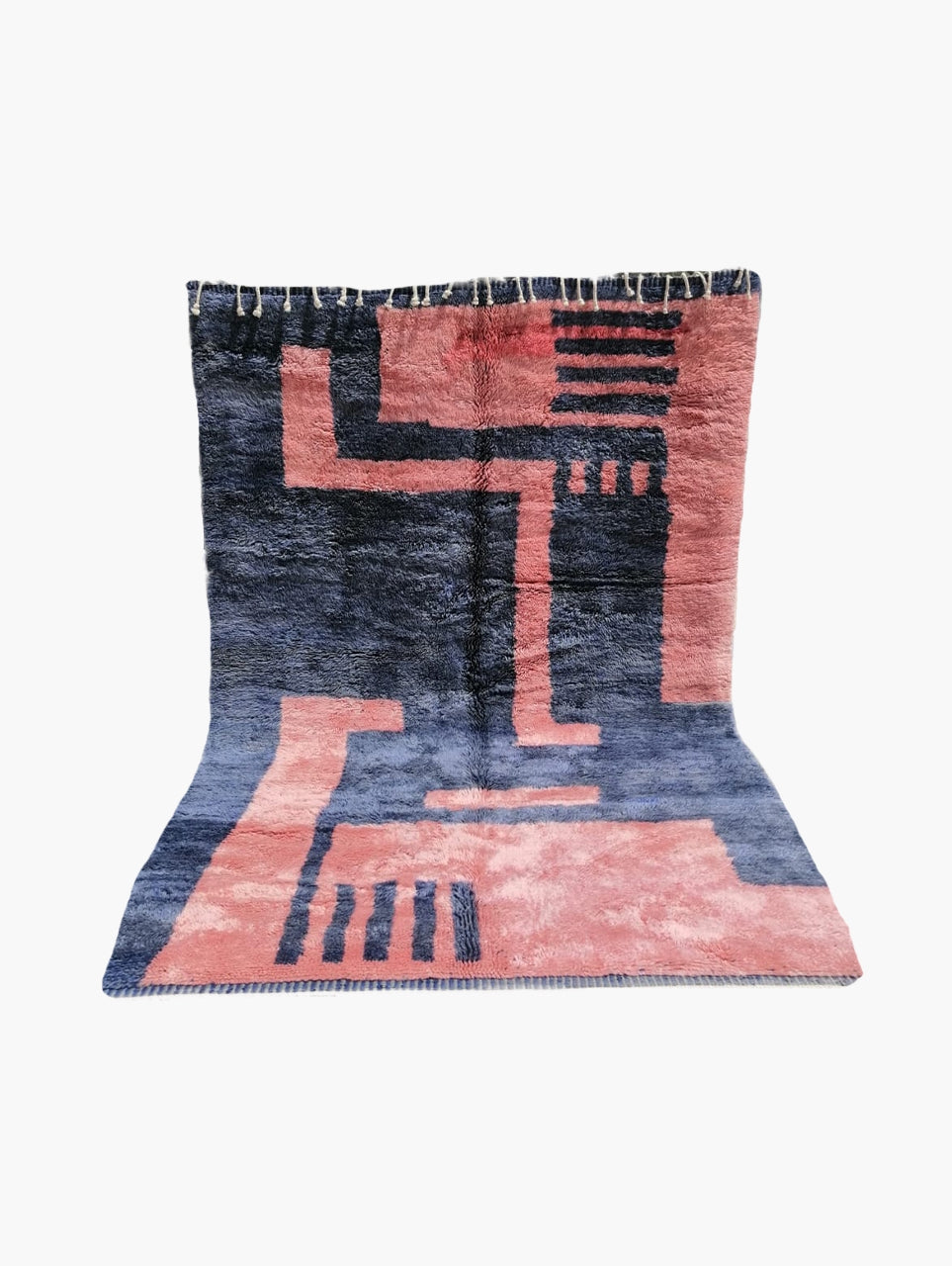 A rectangular rug with geometric patterns in pink and tranquil blue colors.
